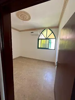 Ground floor 1BHK apartment for annual rent in Ajman – Al Rashidiya 2 | Spacious layout, split AC,
