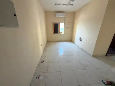 A two-bedroom apartment with a living room is available for annual rent in Al Rashidiya 1, Ajman