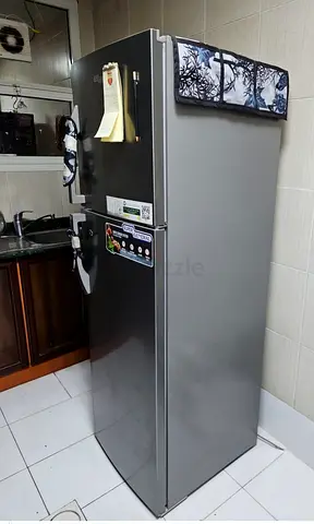 Used single-door refrigerator in good condition - stainless steel finish