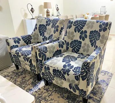 Pair of floral pattern armchairs with cover