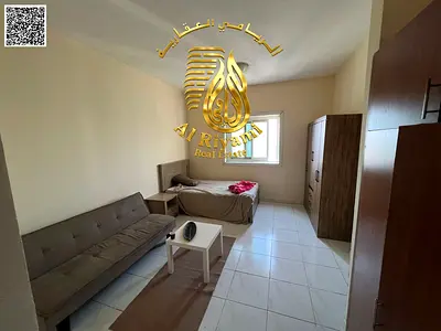 Spacious studio apartment for annual rent, unfurnished, in Al Rashidiya 3, with a separate kitchen.