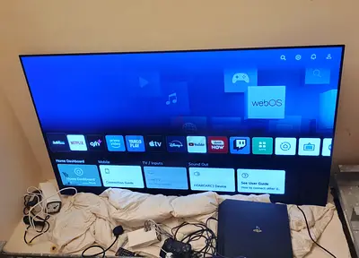 65-inch LG OLED/LED Smart TV with PS4 and accessories - good working condition