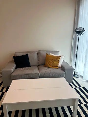 Light grey 2-seater sofa in good condition (cushions not included)