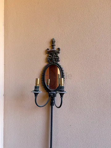 Ornate Vintage-Style Wall Mirror with Metal Candle Arms
