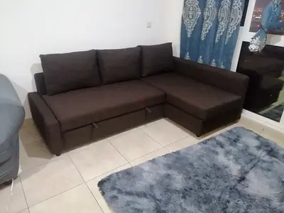 L-shaped Dark Brown Fabric Sofa-bed with storage Ikea - Good Condition