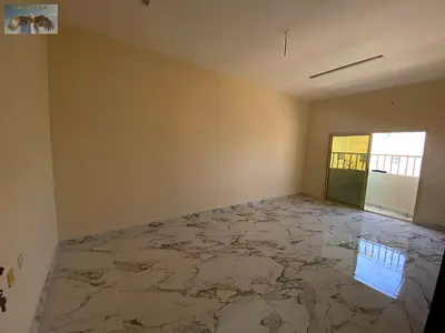 Two-bedroom apartment with a living room for annual rent in Al Rawda, Ajman. Large space with 2 bathrooms and a balcony with an open view. Excellent l