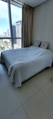 Queen Bed with Englander Mattress and White Quilted Cover — Good Condition