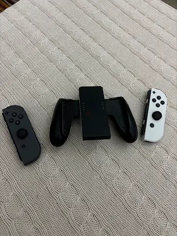 Nintendo switch controllers Original (+) with original Nintendo controller grip