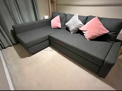 Dark gray L-shaped storage sofa bed with chaise lounge
