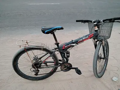 Used Land Rover folding mountain bike with front basket — good for daily rides