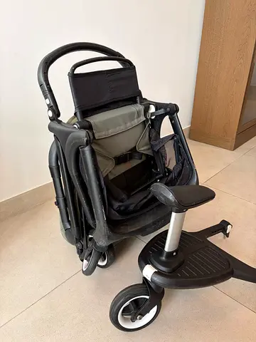 Used compact fold stroller with ride-on board - good condition