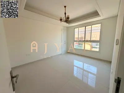 3BR hall apartment in Al Mowaihat 3, new building, 1 month free, built-in wardrobes, central AC, balcony, 3 baths, easy Dubai/Sharjah exit.