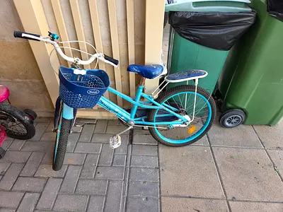 Blue kids bicycle with basket — good working condition