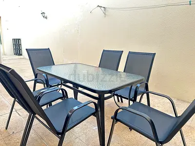 Outdoor Glass-Top Dining Table with 6 Mesh Chairs - Good Condition