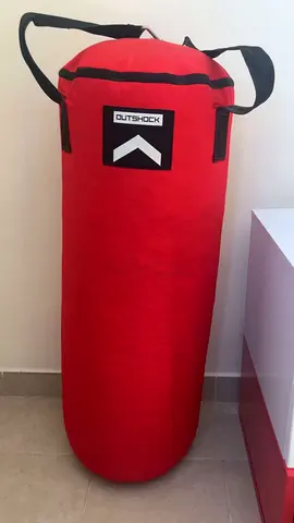 Red hanging Punching Bag with Straps - Good Used Condition