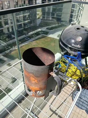 BBQ Grill with charcoal burner and garden hose