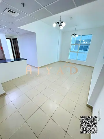 2BR apartment with hall & 2 bathrooms for annual rent in Al Nuaimiya 3, City Tower, Ajman. Private parking, near Dubai & Sharjah exits.