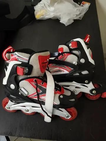 Red  White Adjustable Inline Roller Skates - Good Condition.. its free