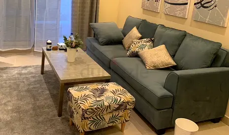 Comfortable 3-seater Sofa in Green with Cushions and Matching Ottoman