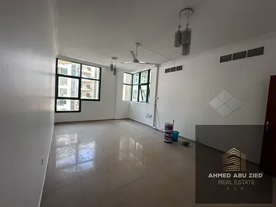 2BR apartment in Ajman Al Rashidiya 1, Al Rashidiya Towers, master room, 2 baths, wardrobes, spacious living room, AED 40,000, 4/6 payments.