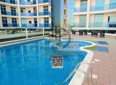 Available now for annual rent: 1-bedroom apartment in Al Waha Tower, located in Al Rashidiya 1 directly on the creek, one of the most desirable reside