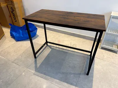 Compact industrial-style study desk with wood top and metal frame
