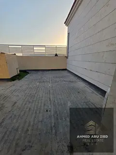 2-bedroom apartment with hall, majlis and large roof for annual rent in Al Rawda 3, prime location n