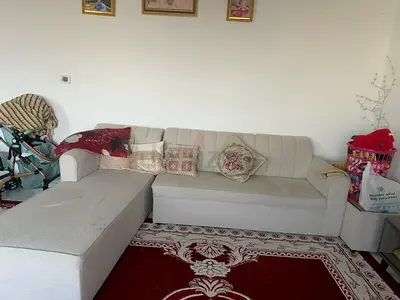 Beige L-shape Sofa with Ottoman — Good Condition