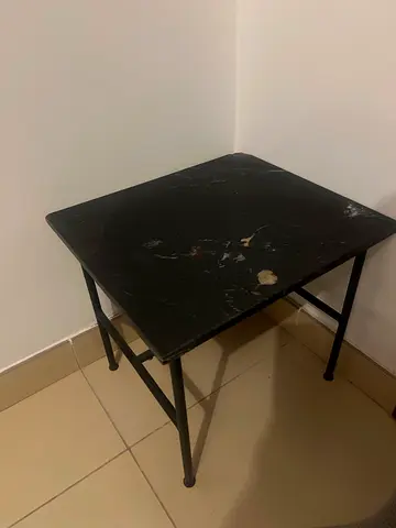 Small black marble-effect side table with metal legs - used