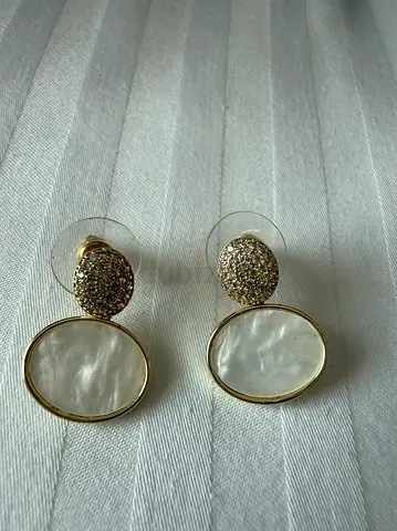 Costume Gold-tone drop earrings with mother-of-pearl and crystal pavé. (Not real jewelry)