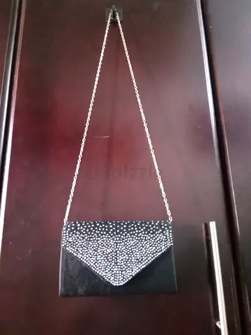 Black satin clutch bag with silver chain strap - good condition