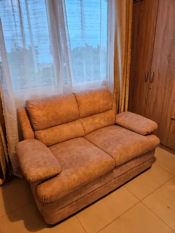 Clean, comfortable brown 2 seater sofa in great condition.