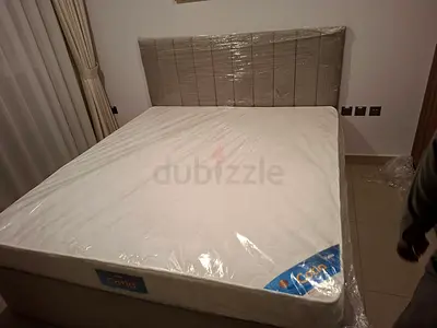 Double bed frame with mattress — like new, wrapped in original plastic