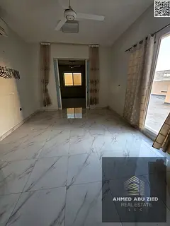 Two bedrooms, a living room, a majlis (formal sitting room), and a large rooftop terrace for rent in