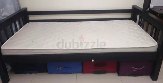 Single wood daybed with mattress — sturdy dark frame, good condition