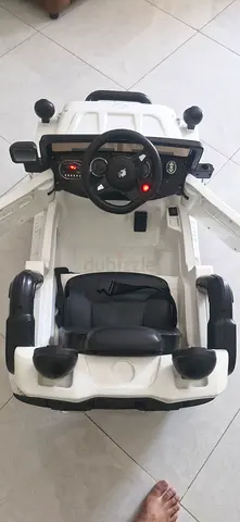 White Electric Ride-On Kids Car with Steering Wheel and Seat Belts