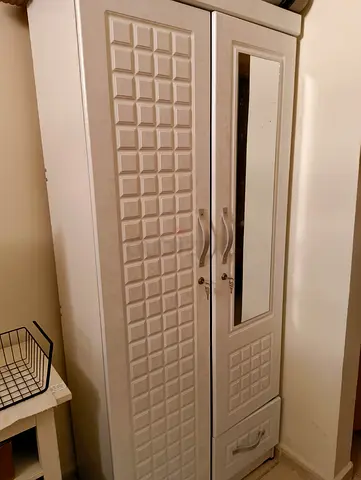 Single bed and wardrobe