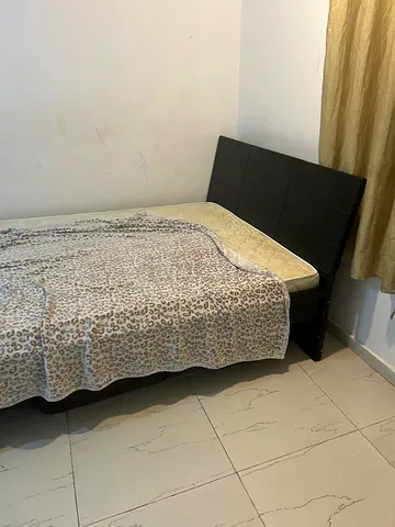 Queen-size bed frame with headboard — dark wood, good condition