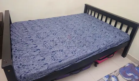 Double wooden daybed with mattress and under-bed storage