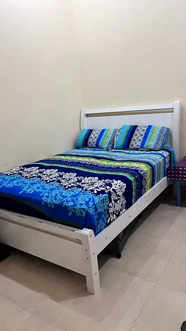 Single white wooden bed frame with mattress and bedding - good condition