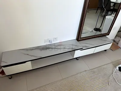 Low modern TV cabinet with marble effect top - white