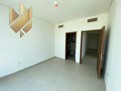 Two-bedroom apartment with a living room in Al Zahia, with parking and free swimming pool access.