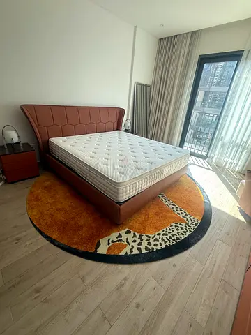 Queen leather bed with mattress and bedside table - excellent condition