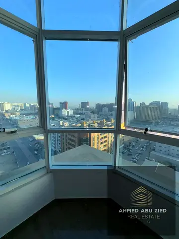 2BR apartment for rent in Ajman, Al Khor Towers, Al Rashidiya, 1480 sq ft, personal finishing, 4 baths, maid room, 12th floor, open view.