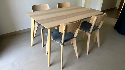 Light wood dining table with 4 matching chairs