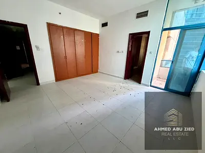Two bedrooms and a living room for annual rent in Al Rashidiya 2, Falcon Towers. Open view, 3 balconies, 3 bathrooms,