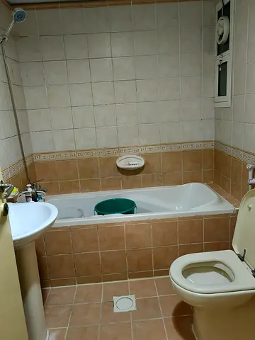 Furnished bedroom with attached bath