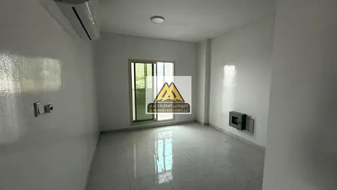 Spacious Family Apartment in Al Rawda 2 - Two Bedrooms, Living Room, and Two Bathrooms