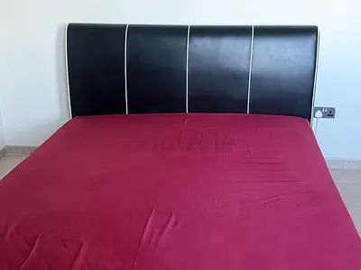 Queen black faux leather bed frame with headboard - good condition
