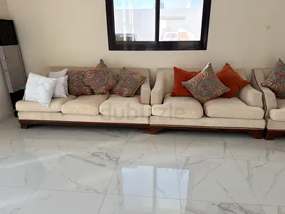 Long cream fabric sofa set with wooden base and others